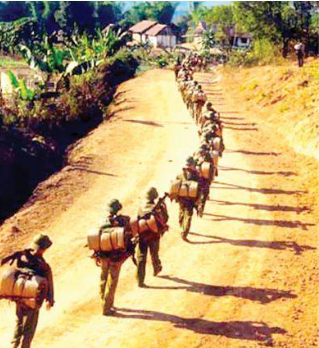 North Vietnamese soldiers head to the Ho Chi Minh Trail for a long march south.